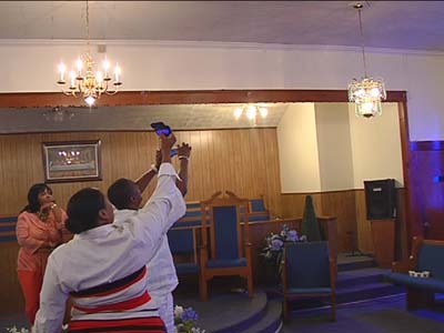 Churchgoerâ??s photograph lights; see God, claim miracle.